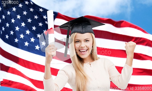 Image of happy student girl with diploma over american flag