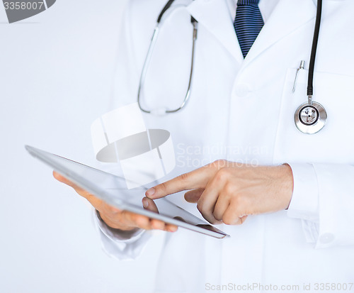 Image of male doctor holding tablet pc