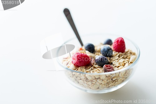 Image of close up of bowl with granola or muesli on table