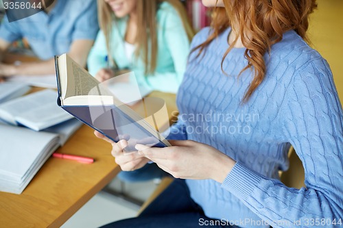 Image of close up of students reading books at school