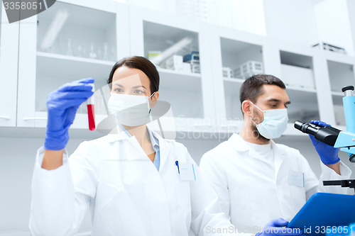 Image of young scientists making test or research in lab