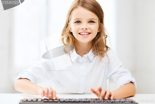 Image of student girl with keyboard