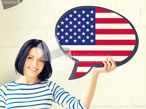 Image of smiling woman with text bubble of american flag