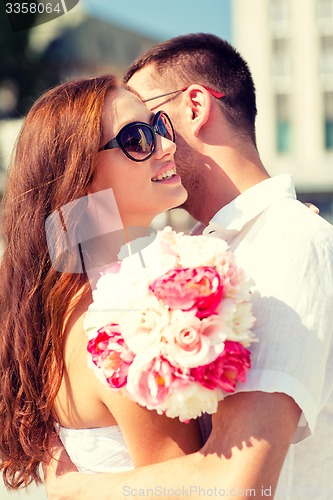 Image of smiling couple in city