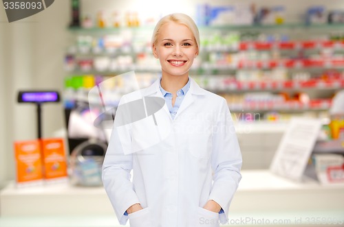 Image of young woman pharmacist drugstore or pharmacy