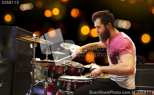 Image of male musician playing cymbals at music concert