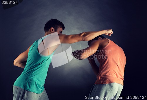 Image of young men wrestling