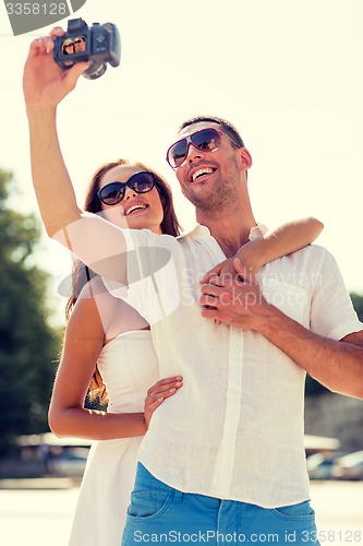 Image of smiling couple in city