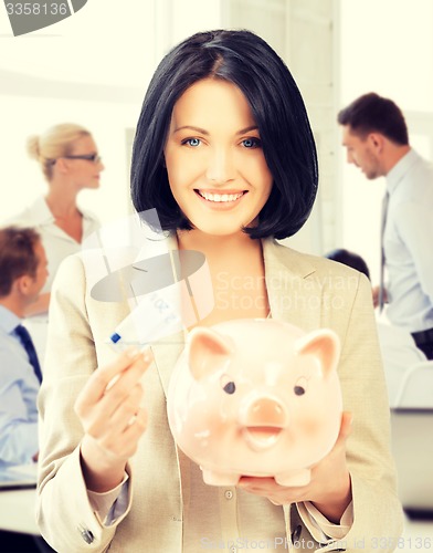 Image of woman with piggy bank and cash money