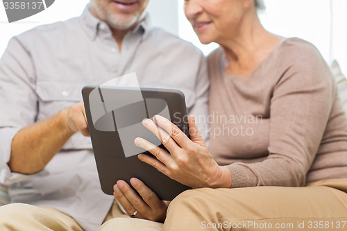 Image of close up of happy senior couple with tablet pc