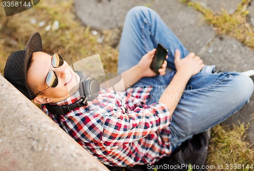 Image of girl with headphones and smartphone