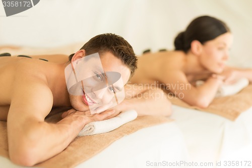 Image of couple in spa with hot stones