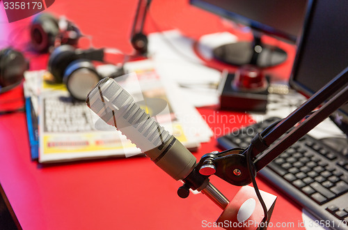 Image of microphone at recording studio or radio station