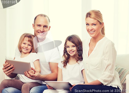 Image of family and two kids with tablet pc computers