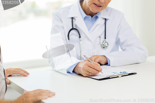 Image of close up of senior doctor and patient at hospital