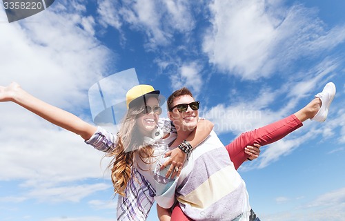 Image of teenagers having fun outside