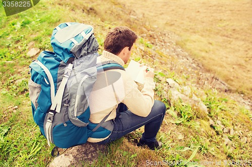 Image of man with backpack hiking