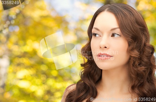 Image of beautiful young woman with bare shoulders