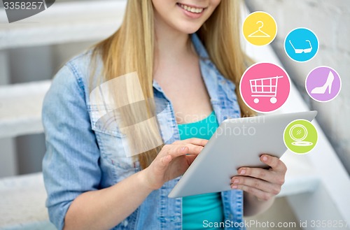 Image of close up of female hands with tablet pc on stairs