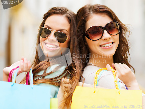 Image of girls with shopping bags in ctiy