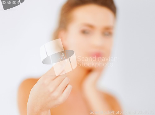 Image of woman with wedding ring