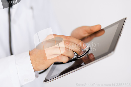 Image of doctor with stethoscope and tablet pc