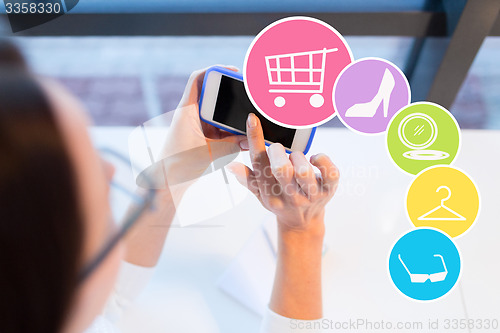 Image of close up of woman with smartphone at office