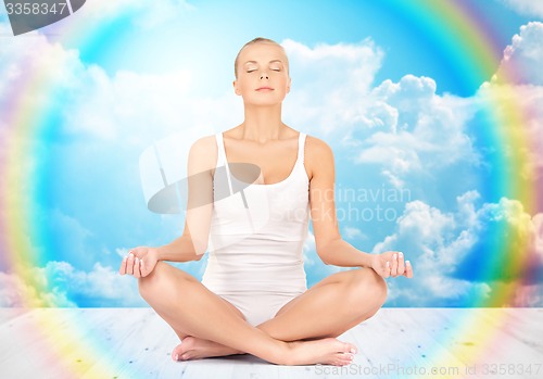 Image of woman meditating in yoga lotus pose