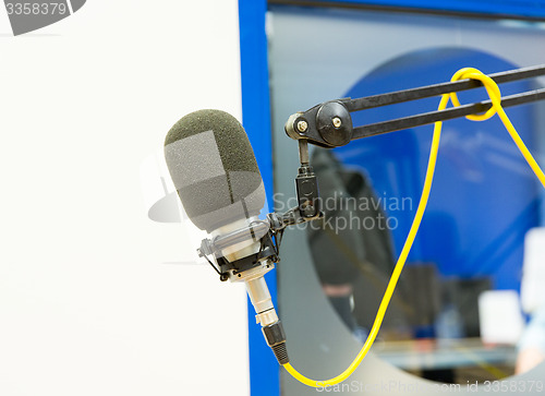 Image of microphone at recording studio or radio station