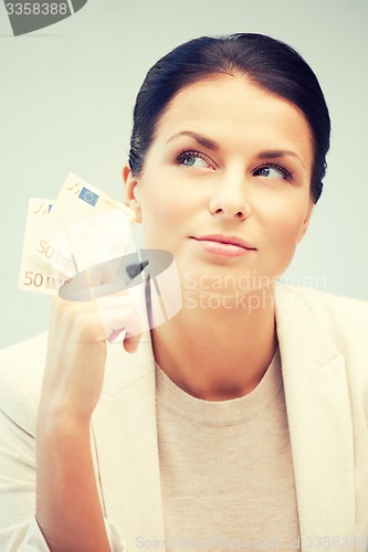 Image of lovely woman with euro cash money