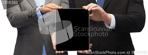 Image of businessman and businesswoman with tablet pc