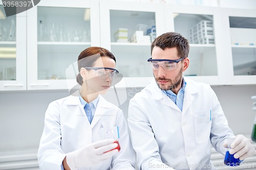Image of young scientists making test or research in lab
