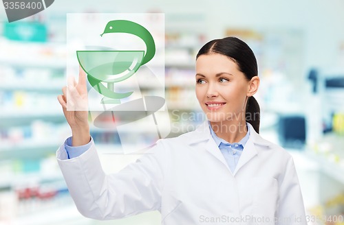 Image of young woman pharmacist drugstore or pharmacy