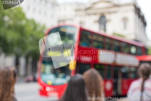 Image of city street with red double decker bus in london