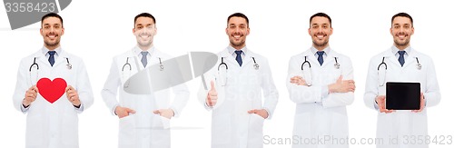 Image of doctors with red heart, tablet pc and clipboard