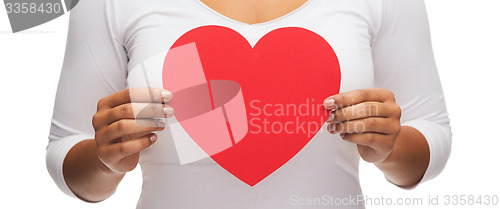 Image of closeup of woman hands with heart