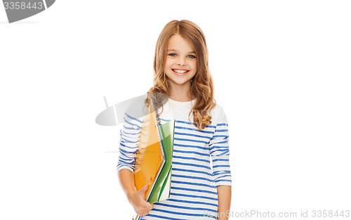 Image of child holding colorful folders