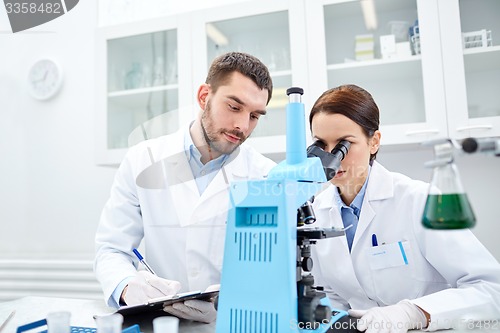 Image of young scientists making test or research in lab