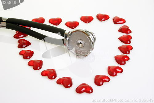 Image of Stethoscope with red plastic hearts
