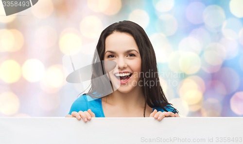 Image of smiling young girl with blank white board