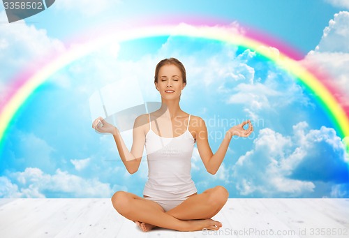 Image of woman meditating in yoga lotus pose