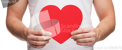 Image of closeup of man hands with heart