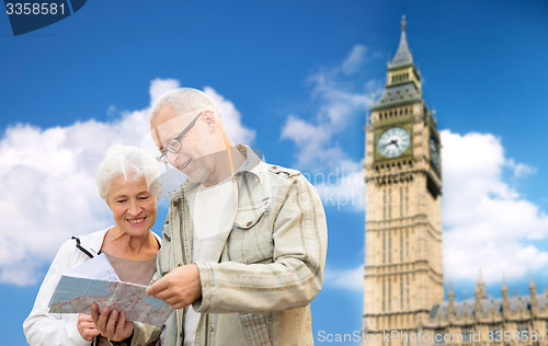 Image of senior couple with map over london big ben tower