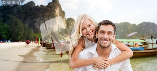 Image of happy couple having fun on summer beach