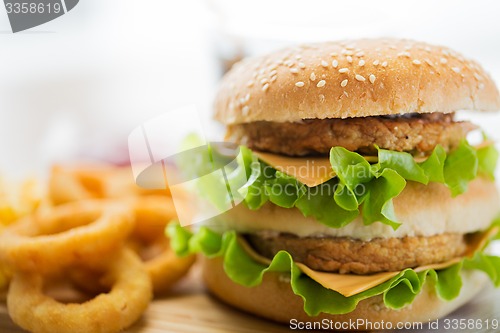 Image of close up of hamburger or cheeseburger on table