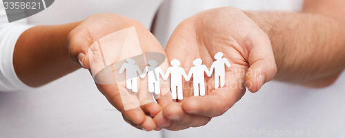 Image of couple hands with paper team