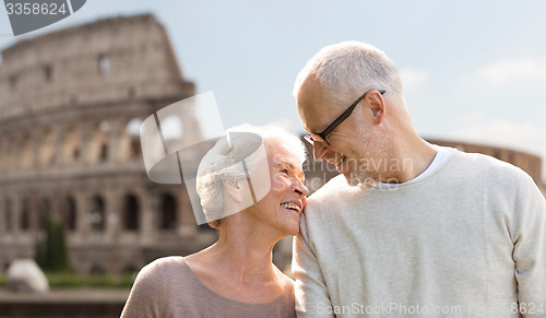 Image of happy senior couple over coliseum in rome, italy