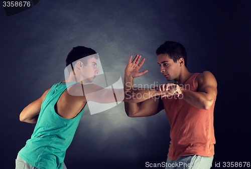 Image of young men wrestling