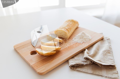 Image of close up of white bread or baguette and knife