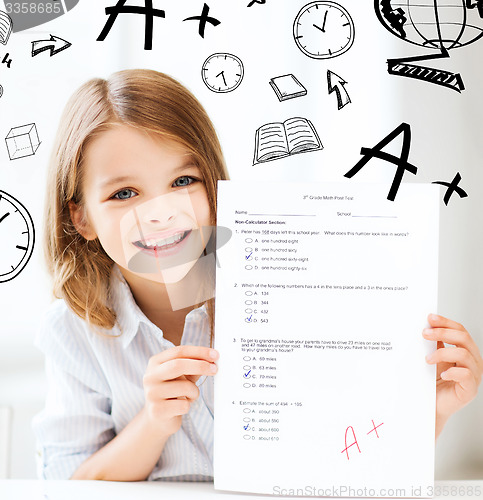 Image of girl with test and A grade at school